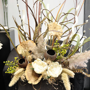 Custom artificial/permanent and dried arrangements for all your home decor needs including unique display vessels.